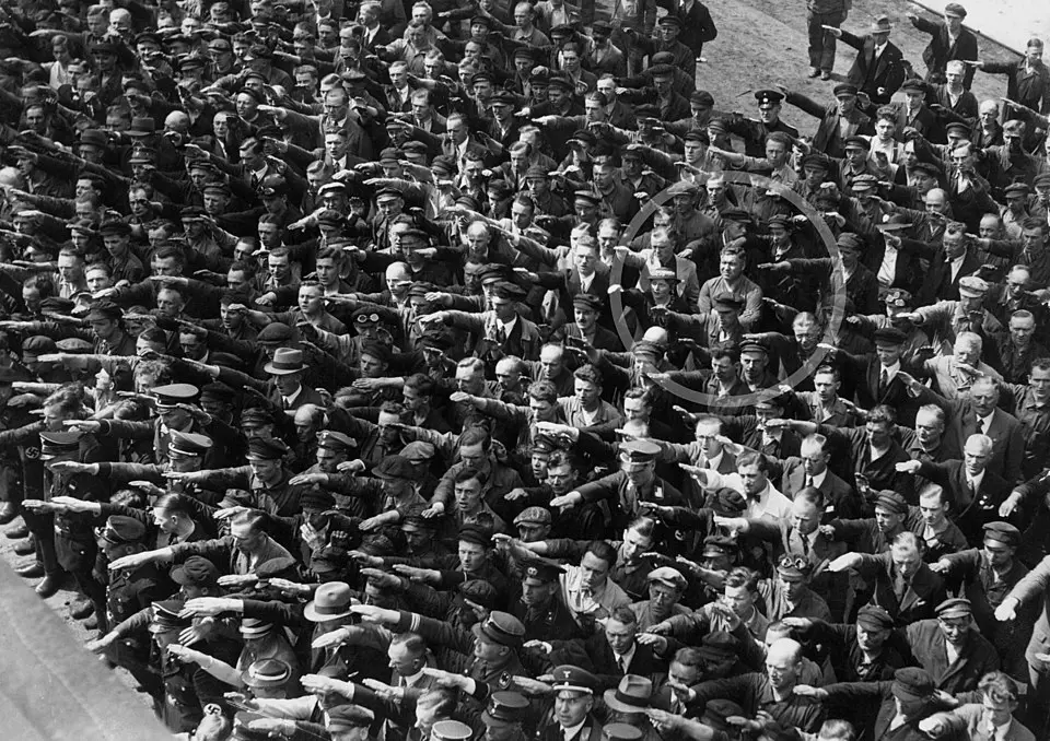  Picture of people giving a Nazi salute, with an unidentified person (possibly August Landmesser or Gustav Wegert) refusing to do so. This image is in the public domain because its copyright has expired and its author is anonymous. This applies to the European Union and those countries with a copyright term of 70 years after the work was made available to the public and the author never disclosed their identity.