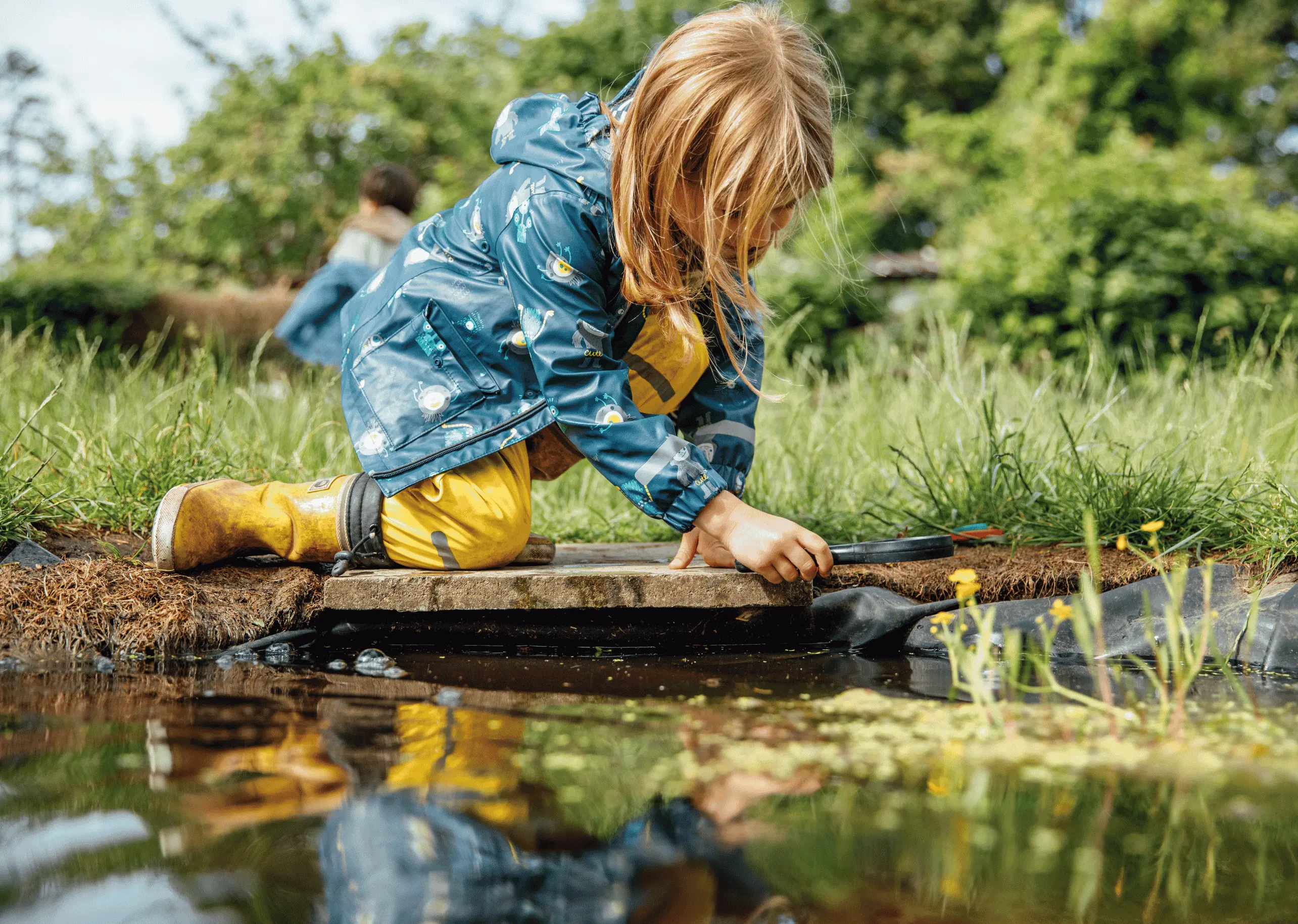 Children in forest school at St Chris nursery