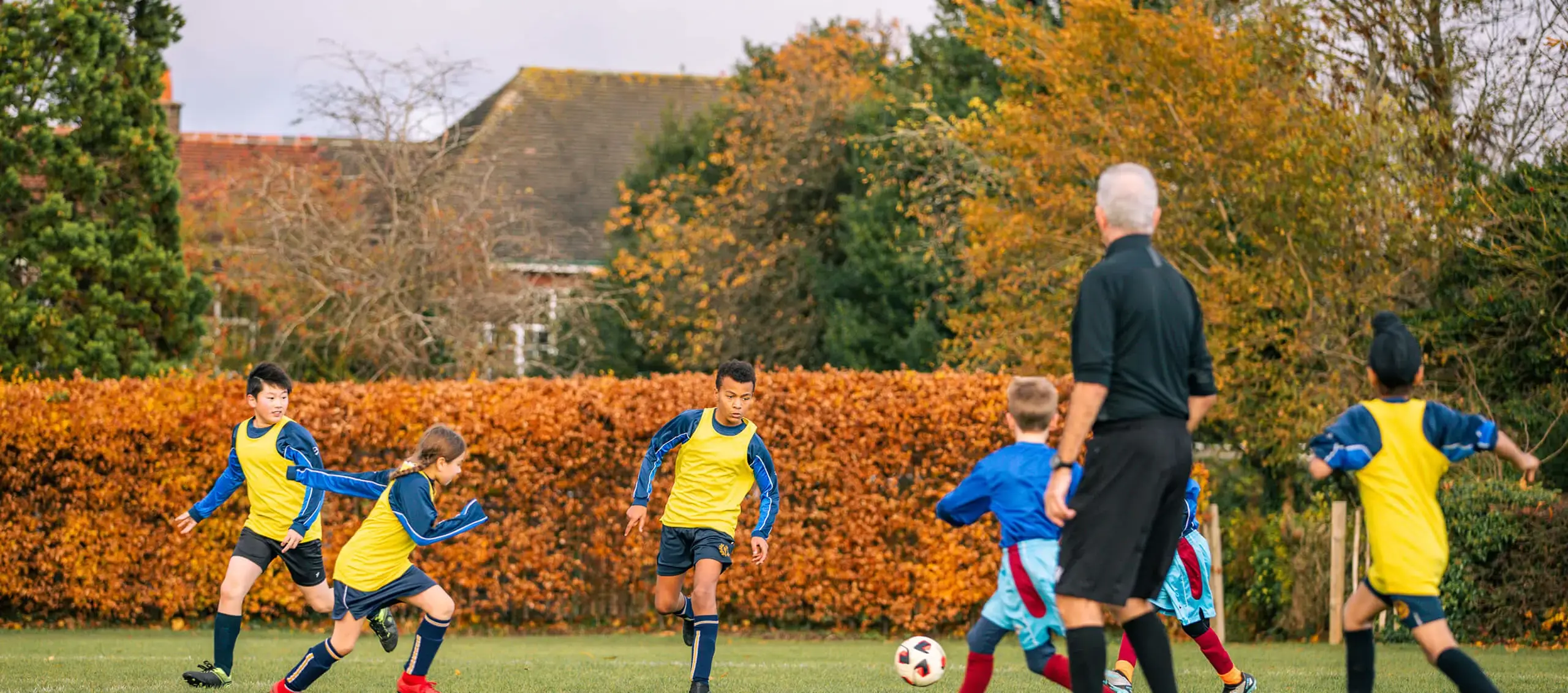 St Chris Junior School pupils playing football