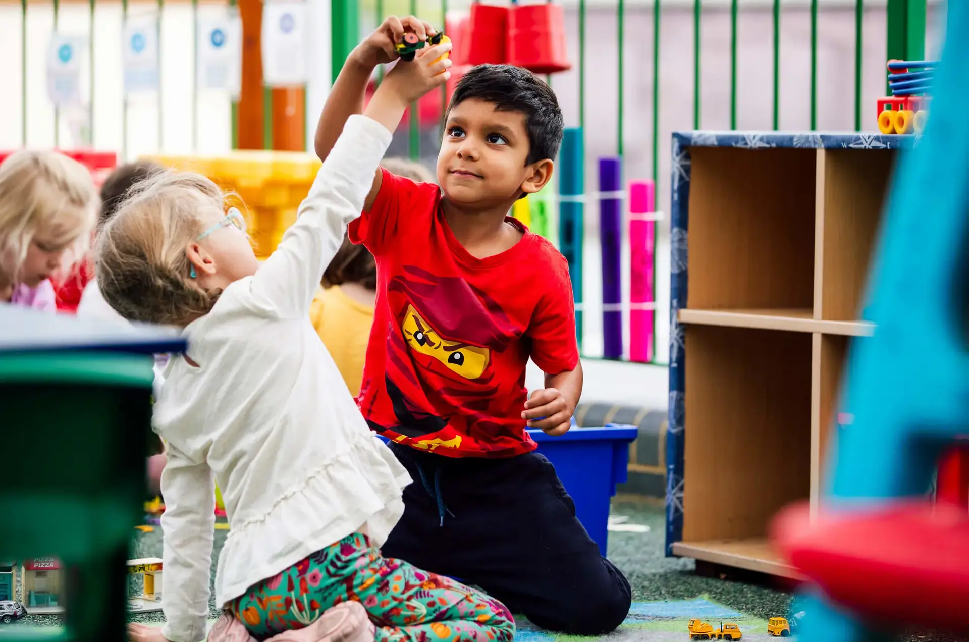 Junior School pupils playing together in class