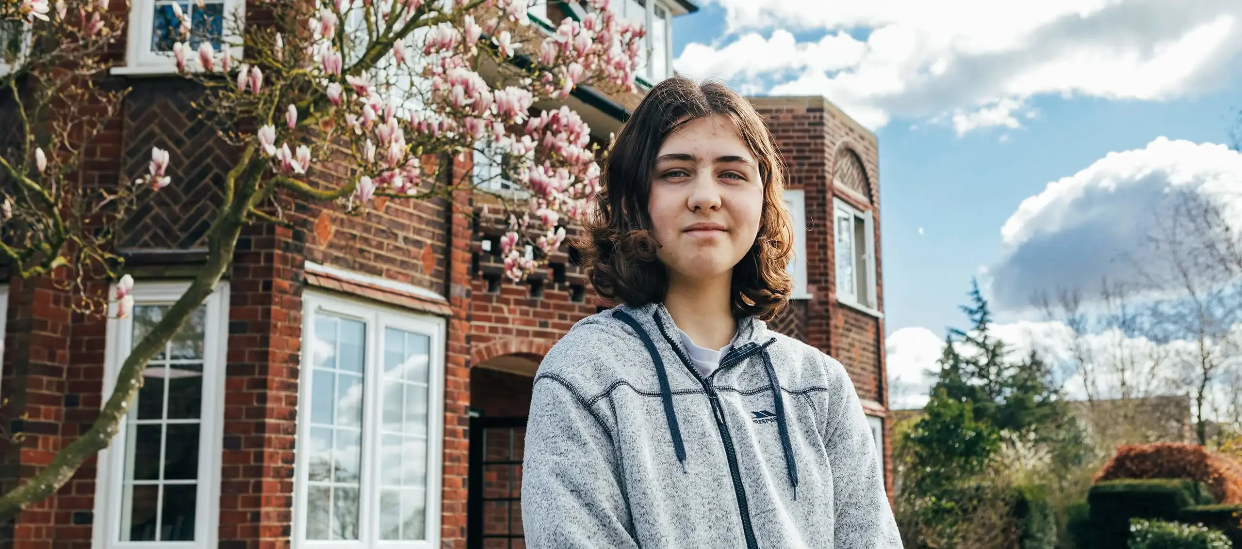 Student standing in the school grounds at St Chris