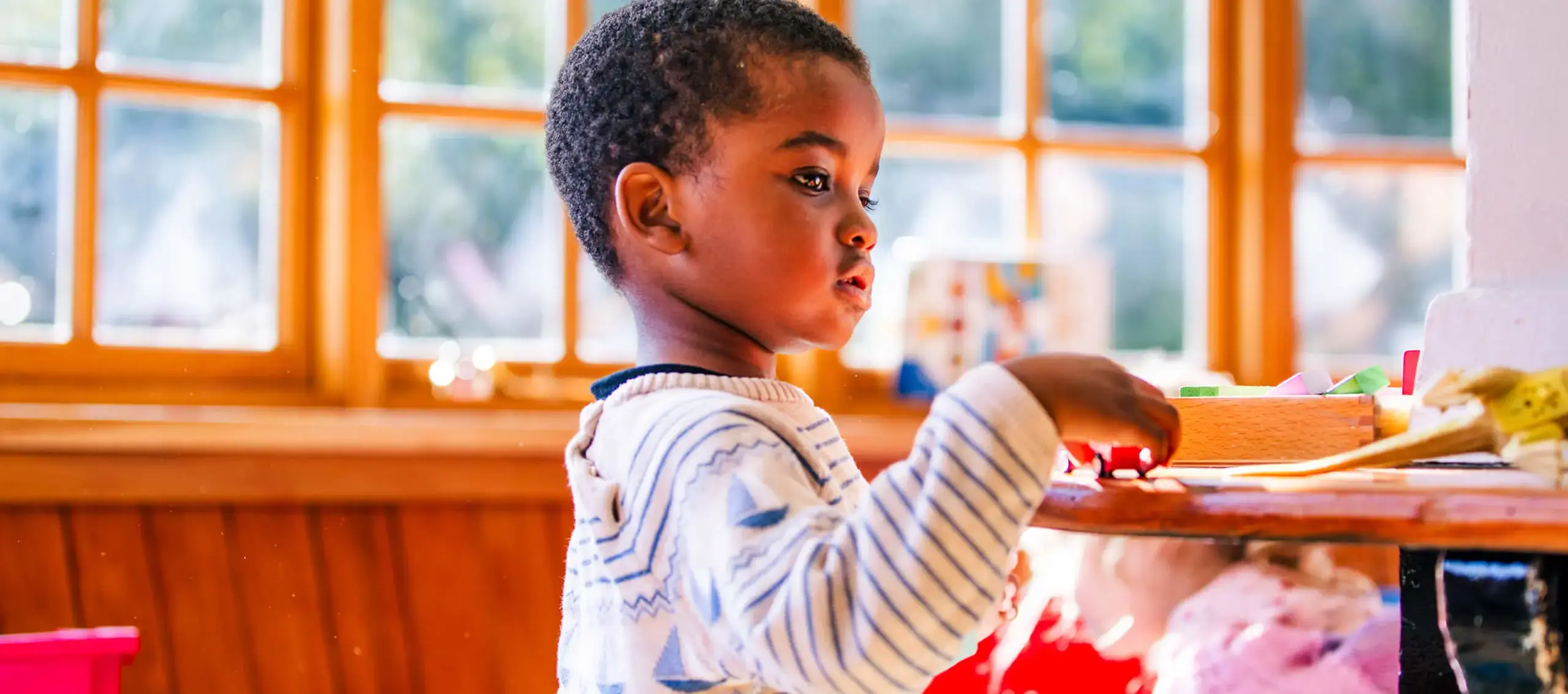 Nursery pupil in class at St Chris