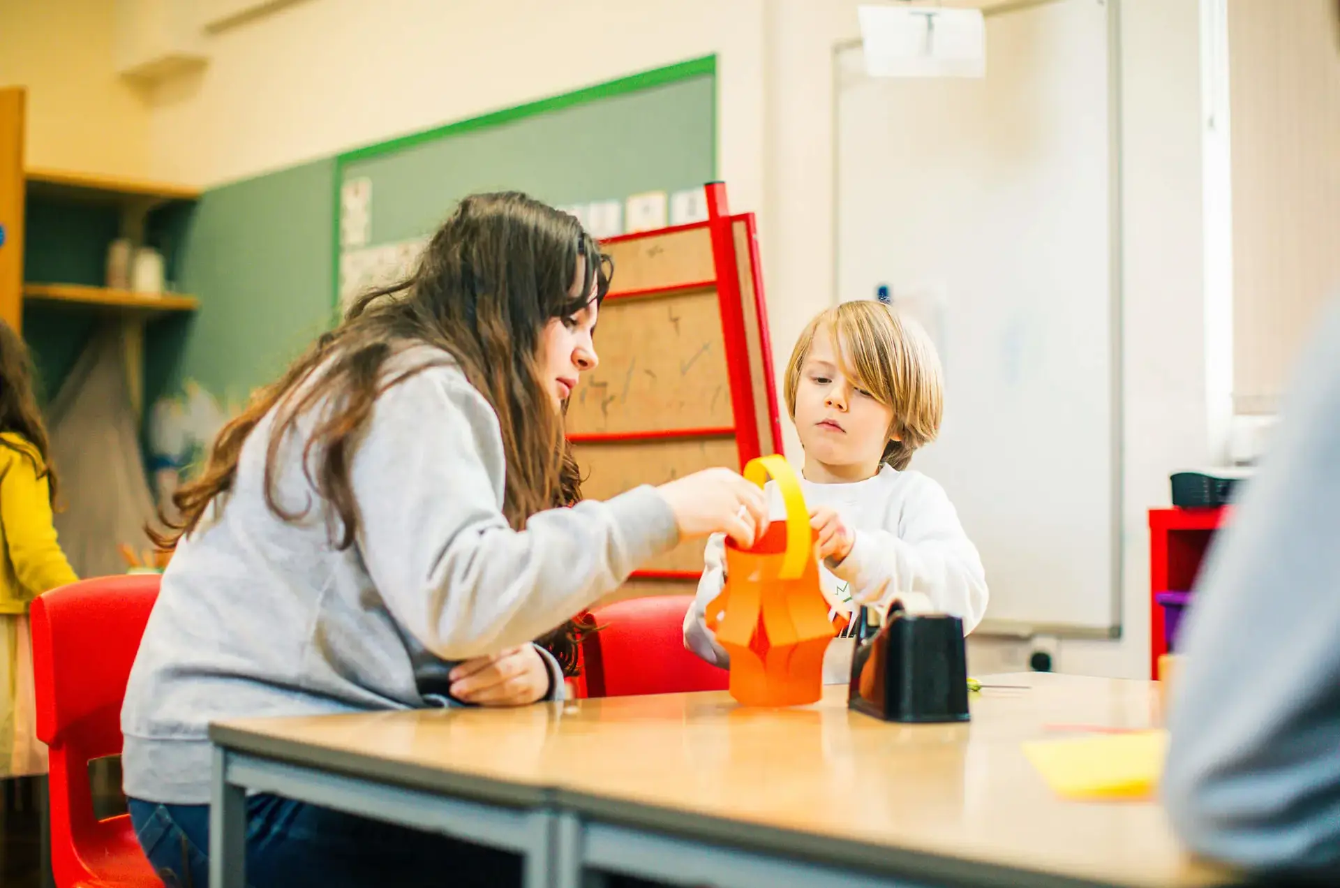 St Chris junior school pupil in class with teacher