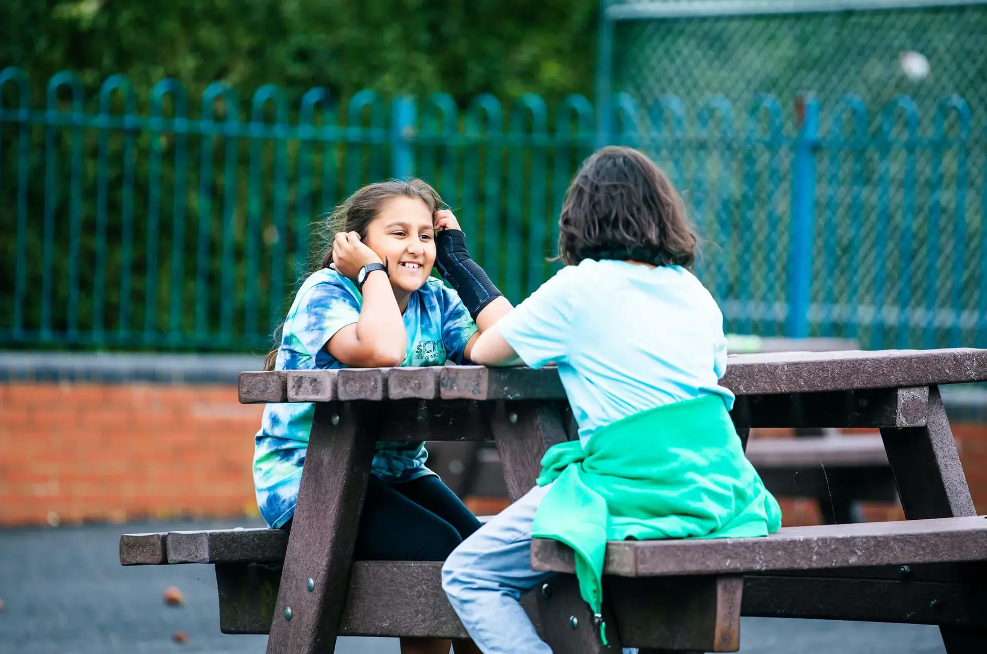 Junior School pupils chatting in the playground