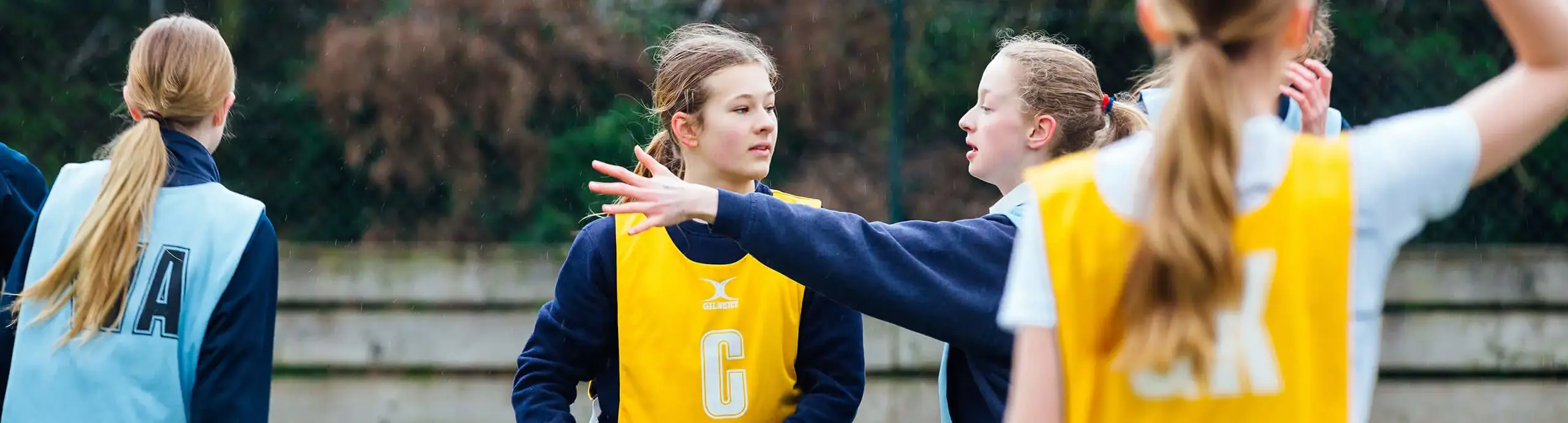 Pupils playing netball