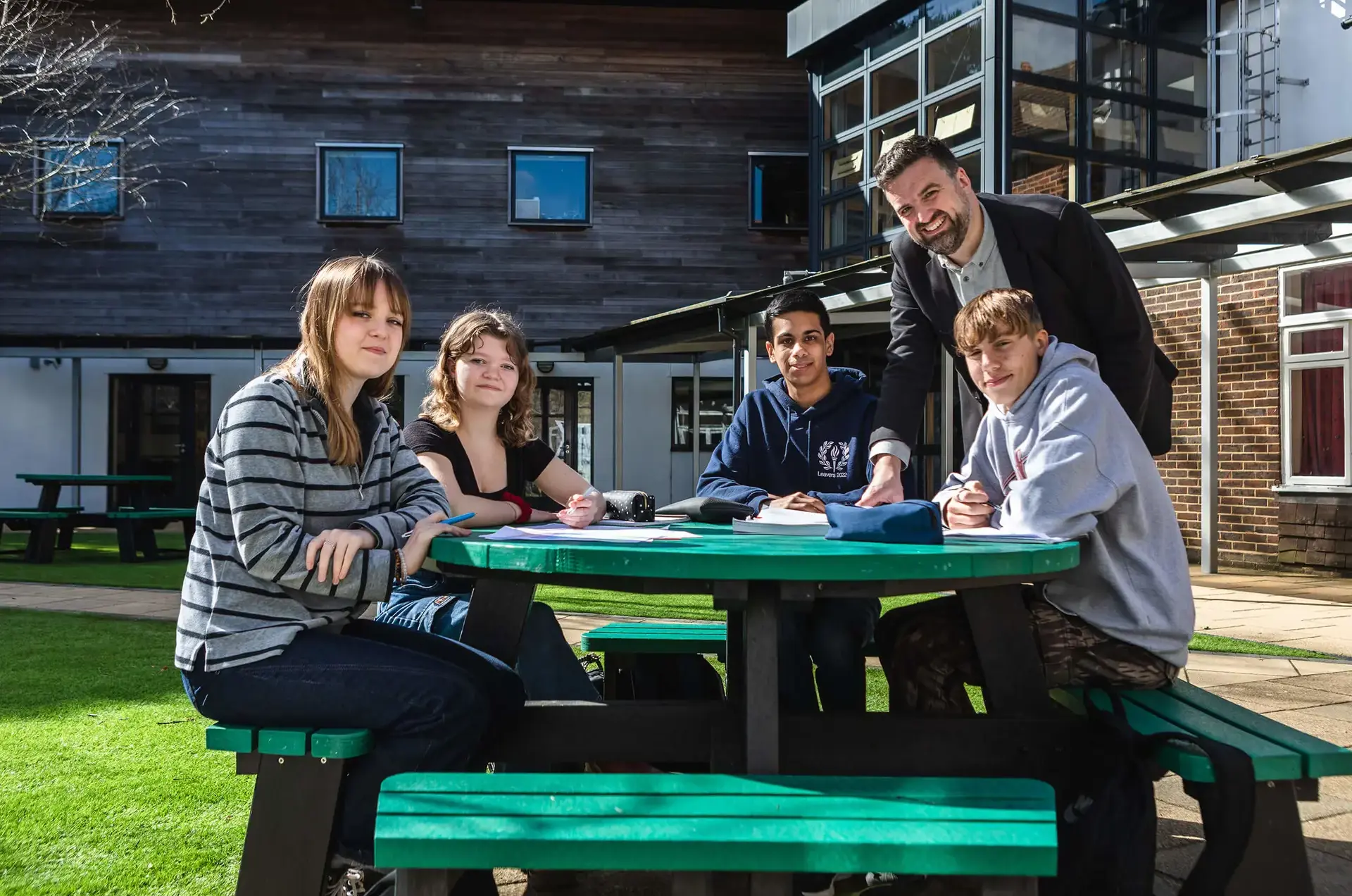 Students and teacher working outside